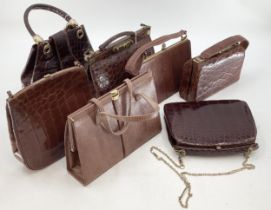 A quantity of brown leather vintage ladies handbags, and two leather briefcases