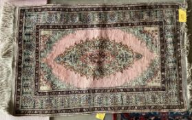 A Tabriz style rug, silk and wool pink central ground 89 x 155cm
