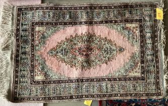 A Tabriz style rug, silk and wool pink central ground 89 x 155cm