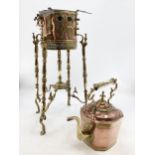 A Victorian copper and brass kettle on stand with original heating box, pierced gallery on scrolling