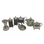 A collection of sterling silver table items to include a pair of Adams Style Pepperets, A pepper