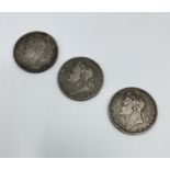 A George III 1822 Tertio Crown together with two 1821 examples