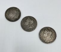 A George III 1822 Tertio Crown together with two 1821 examples