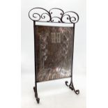 An Arts & Crafts secessionist style wrought iron and copper fire screens 86cmh