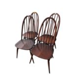 A dark wood ERCOL fall flap table 74cm wide, and spindle back chairs, and a settee