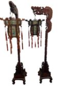 A pair of Chinese hardwood court dragon lanterns with hexagonal hand painted glass and hardwood