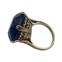 A 9ct gold dress ring, single circular free cut amethyst coloured paste stone in a six claw setting,
