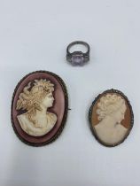 An unmarked white metal gem set ring , together with two small cameo brooches
