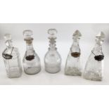 A collection of C19th/C20th glass decanters, a triple ring necked example, some with white metal