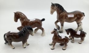 A collection of Beswick shire horses, various sizes (5)