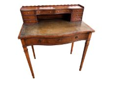 Ladies walnut serpentine fronted writing table with green leather top, key present to main drawer