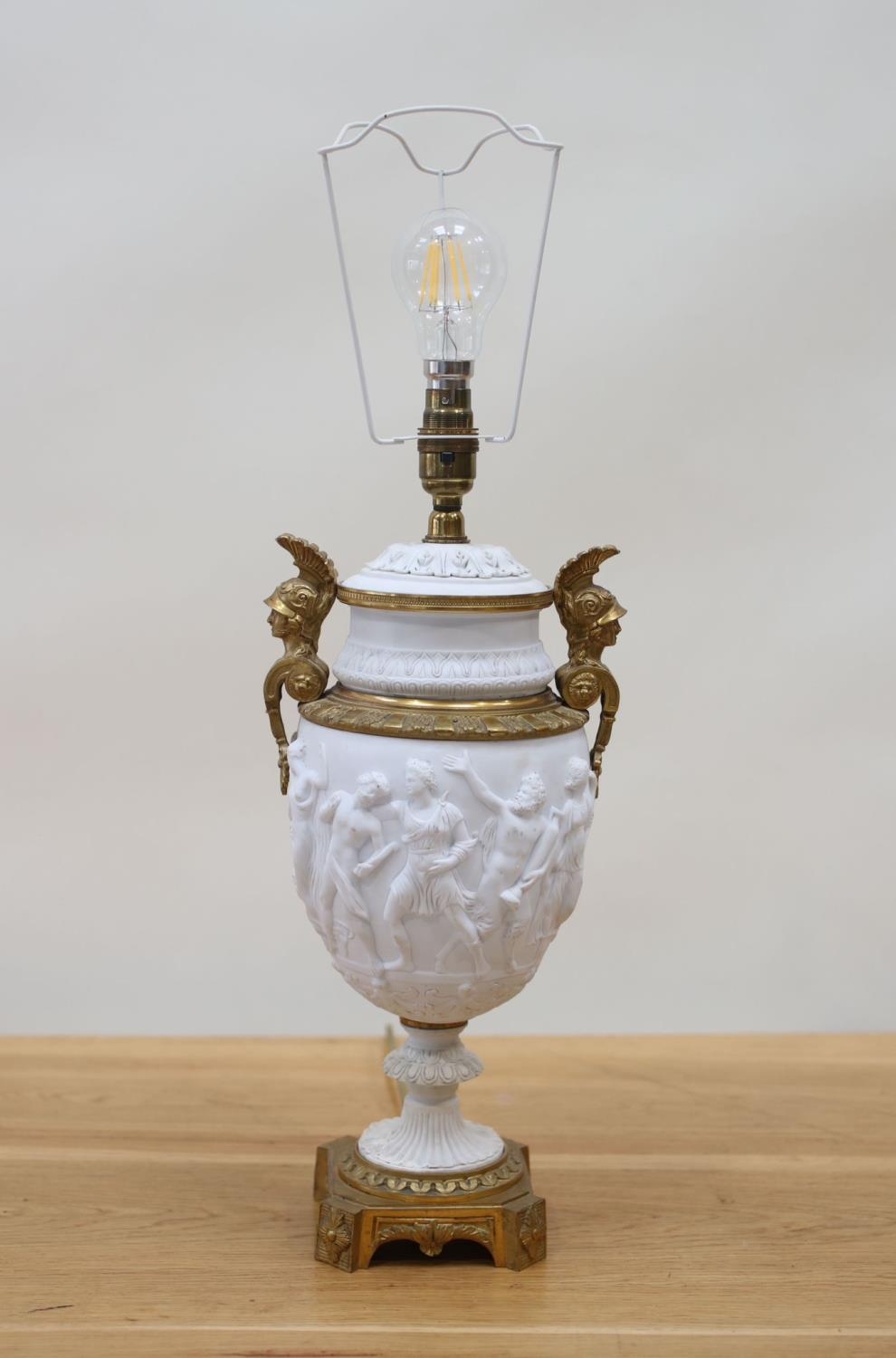An Empire period biscuit porcelain urn with bas relief and solid brass mounts, as a table lamp, - Image 2 of 3