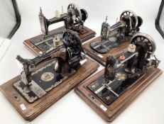 Four vintager sewing machines, with boxes