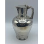 Sterling silver lidded jug, on circular stepped foot, by John Wilmin Figg, London, 1837, 21.5otz