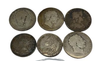 A 1709 Queen Anne shilling together with George III and George III Crowns