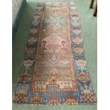 A Persian style rug runner, as found