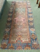 A Persian style rug runner, as found