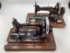 Four vintage sewing machines, Titan, New White Peerless, Bradbury, Frister, and Rossman with boxes