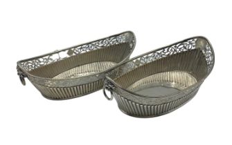 Pair of Sterling Silver pierced oval baskets with lion and ring handles, Sheffield, 1885, 516g, some