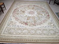 Aubusson needlepoint rug, in greens and creams, with pink medallions of roses to centre, 267 x 365cm