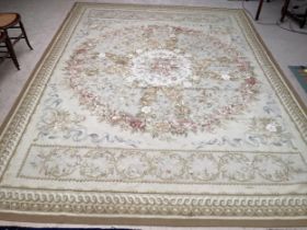 Aubusson needlepoint rug, in greens and creams, with pink medallions of roses to centre, 267 x 365cm