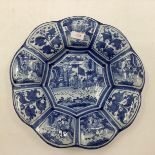 An oriental style blue and white slip ware , 9 lobbed Frankfurt Faience "buckel platte" charger 31cm