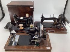 Four vintage sewing machines, Singer, Vickers, Bradbury, Wheeler and Wilson with boxes