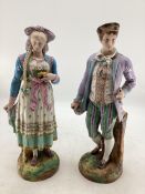 A pair of Continental painted bisque porcelain figures of a man and woman, approx 47cm high