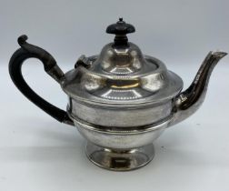 A Sterling Silver bachelors teapot .