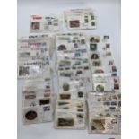 A large collection of first day covers