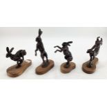 Sweeny, four bronze models of hares on wooden plinth bases, largest 21cmH