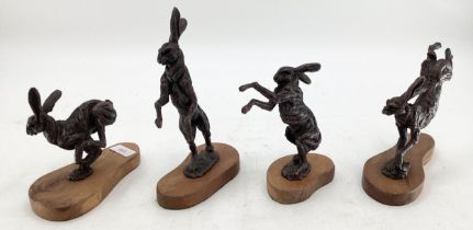 Sweeny, four bronze models of hares on wooden plinth bases, largest 21cmH