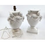 Pair of modern Blanc de chine style table lamps, each with a pair of Putti and swags, 38cm High