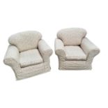 A pair of traditional large deep seated armchairs with lose seat and back cushions, upholstered in