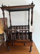 A Victorian rosewood Canterbury with drawer and overshelf , on turned legs and castors