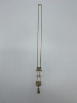 A 9 ct gold chain link necklace with peridot And seed pearl pendant 5.07 g