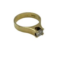 An 18ct gold single stone diamond ring, 6mm brilliant cut diamond in a rub over setting. Size L 4.8g