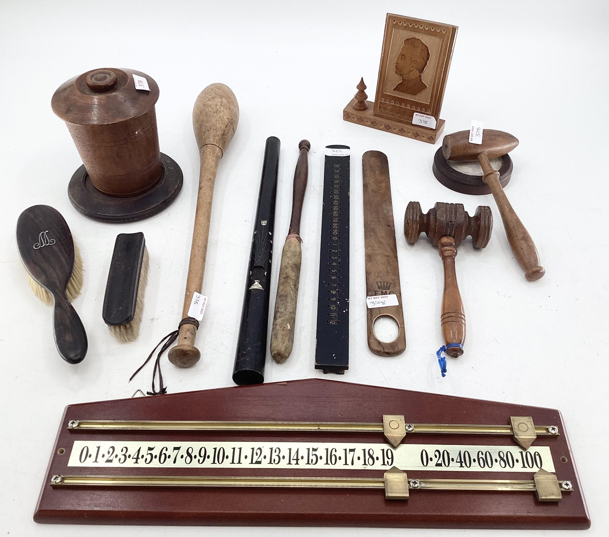 A collection of miscellaneous items to include gavels, score boards, page tuner, carved desktop