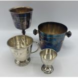 A sterling silver christening cup together with a sterling silver egg cup 120g together with two