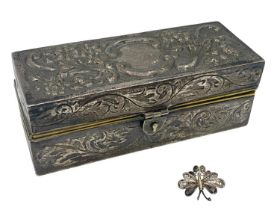 A Sterling silver jewellery casket Repousse scroll decoration with gilt interior 10cm x 4cm x 3.5cm,