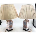 A pair of oriental style table lamps on square wooden bases, 37cm high , plus fittings