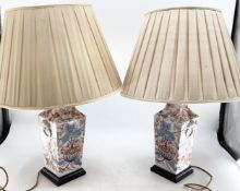 A pair of oriental style table lamps on square wooden bases, 37cm high , plus fittings