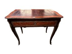 A ladies French Kingwood writing table with a drawer and original leather top with ormolu decoration
