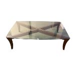 Natuzzi Italy late C20th teak style glass topped coffee table raised on sabre legs 141 cm x 88 cm