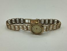 9ct gold cased ladies Accurist cocktail watch on 9ct gold bracelet strap, 13 grams gross weight