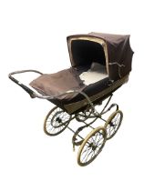 A Vintage Silver Cross Pram from the early 1970s. With wear. From a clean house.