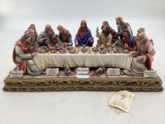 A Capodimonte figural group. The Last Supper by Germano Cortese on a gilt plinth 2007/1566. signed