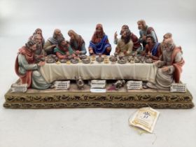 A Capodimonte figural group. The Last Supper by Germano Cortese on a gilt plinth 2007/1566. signed