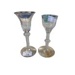 Two C18th spiral stem wine glasses, the smaller with chip to rim, 15 cm (tallest) and three later