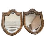 A pair of antique shield shaped gilt frame mirrors, originally from a house in Ireland, some wear